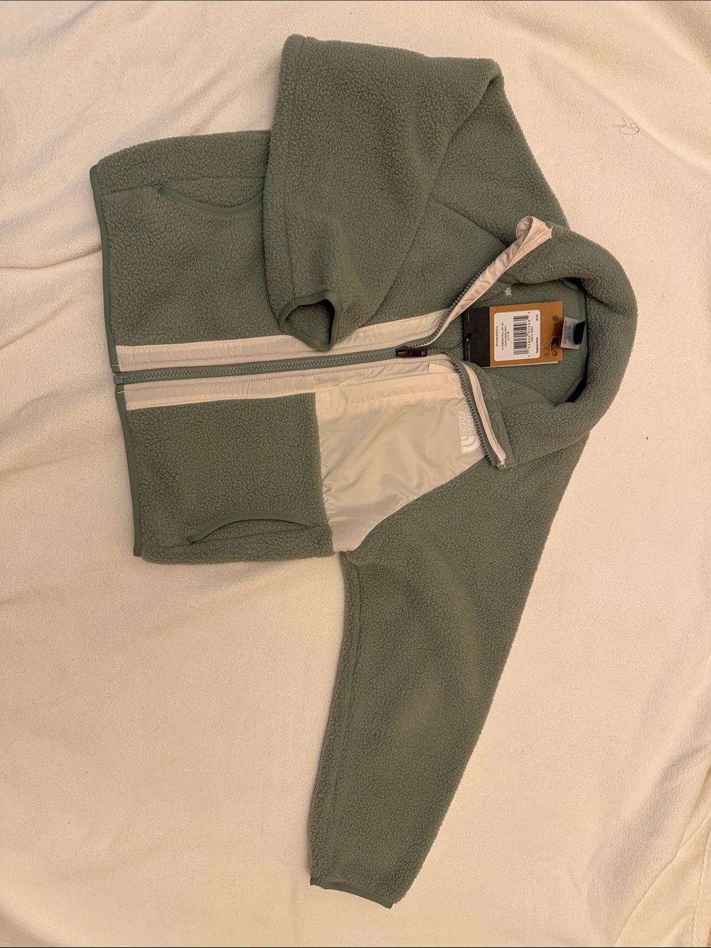 The North Face kids Sage Green Sherpa Zip-Up Jacket with Cream Trim